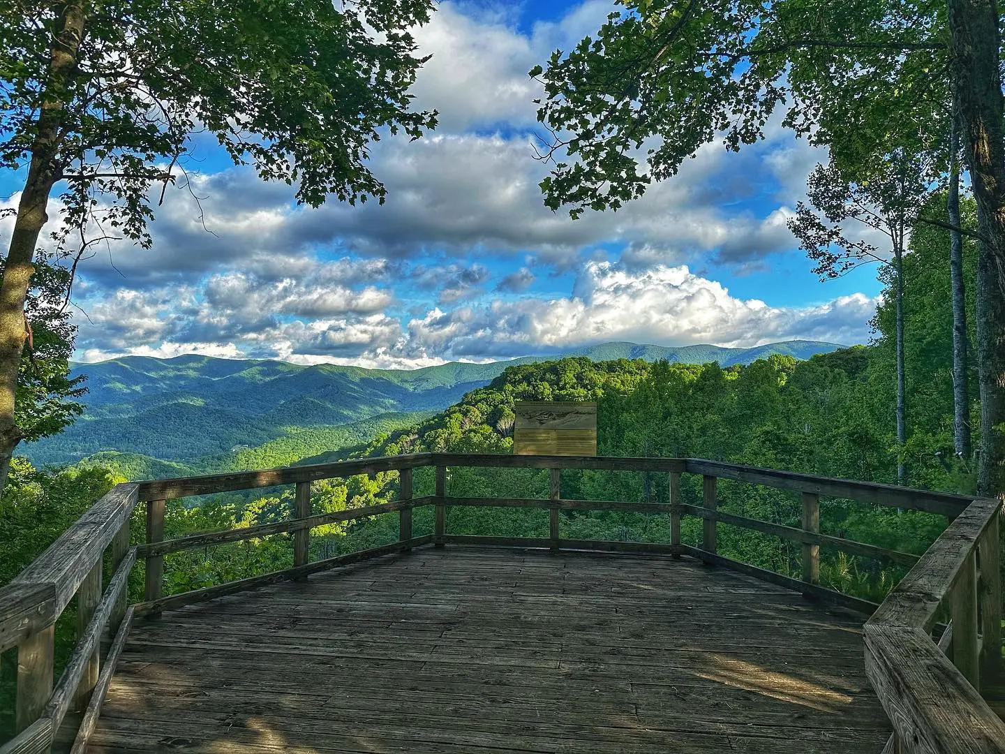Wooden overlook platform framing mountain views