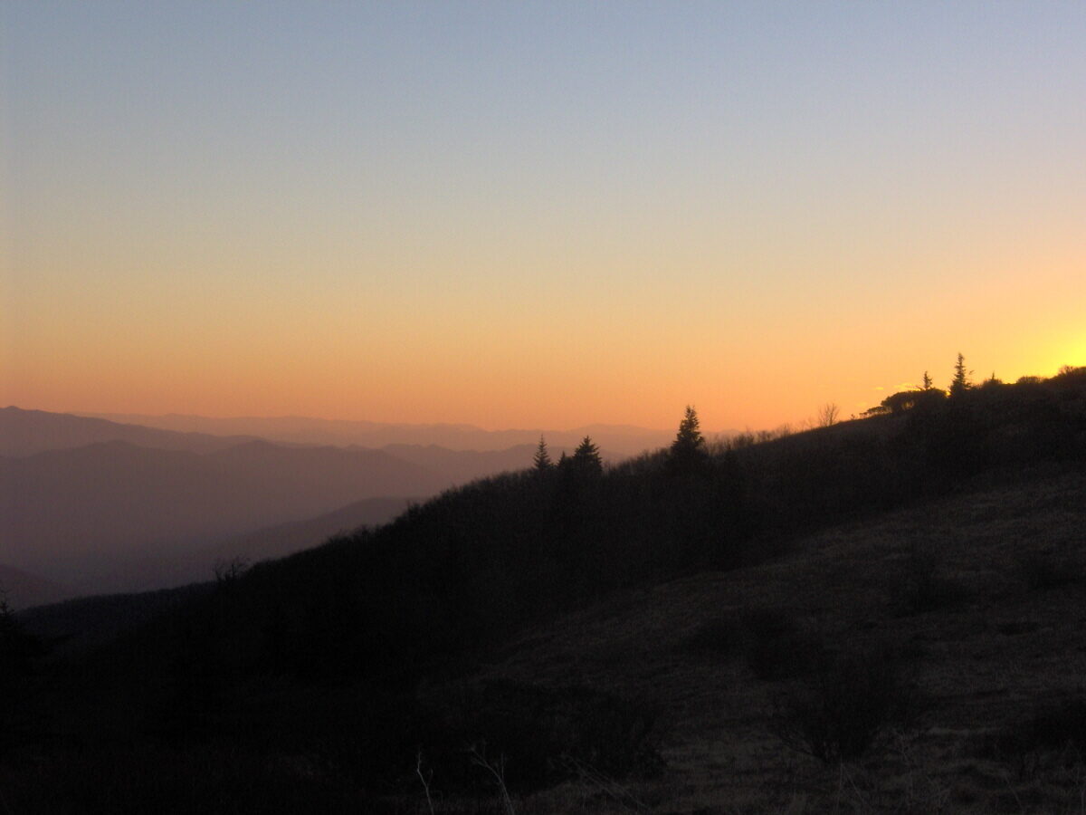 Sunset over layered Blue Ridge ridgelines from Grassy Ridge in the Roan Highlands