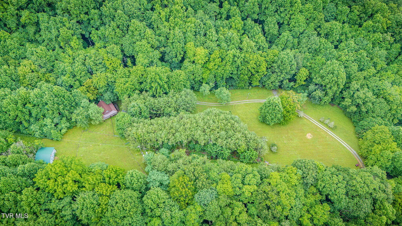 Aerial view of Misty Hollow meadow with Bear Cabin and Creek Cabin cabins